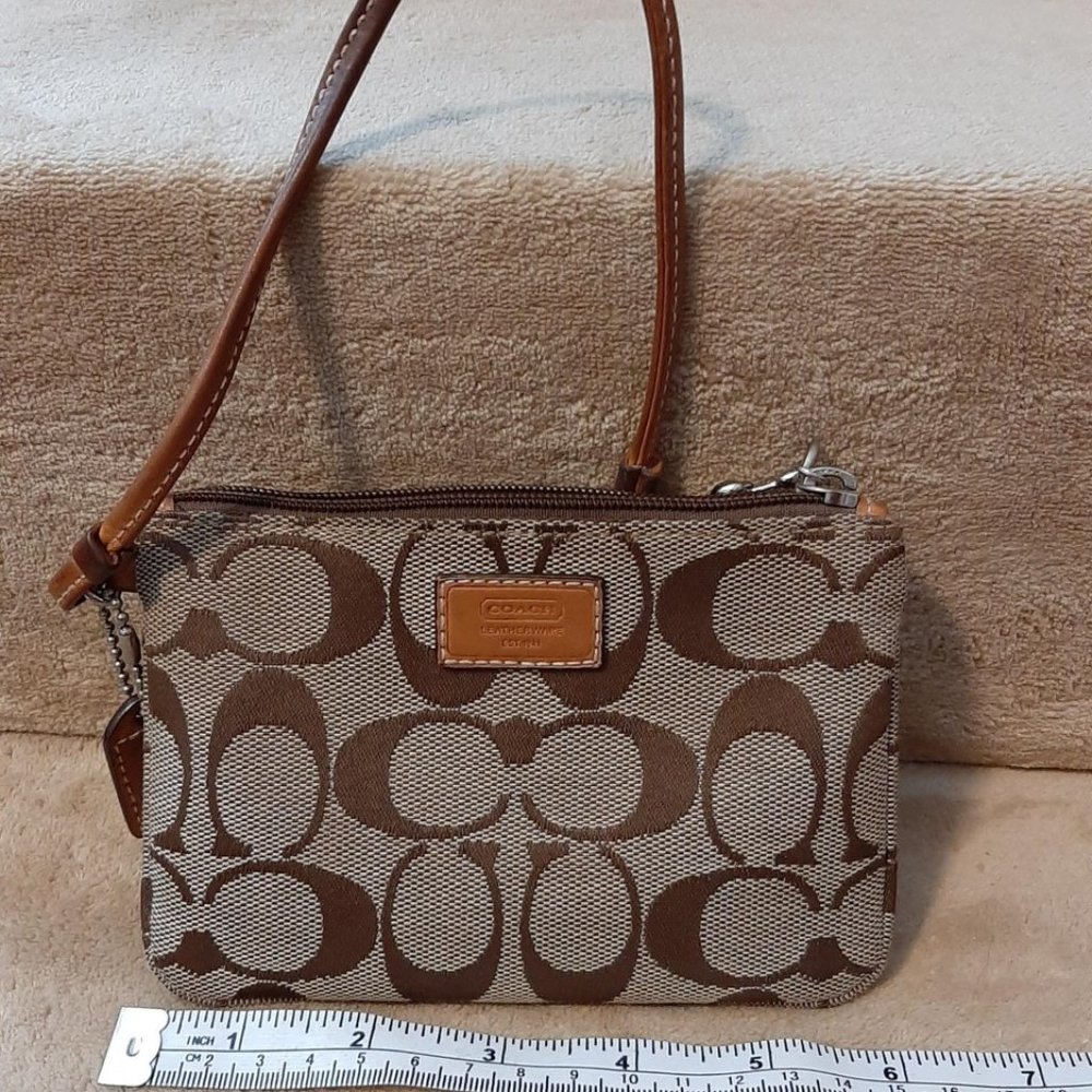 Coach Signature logo wristlet